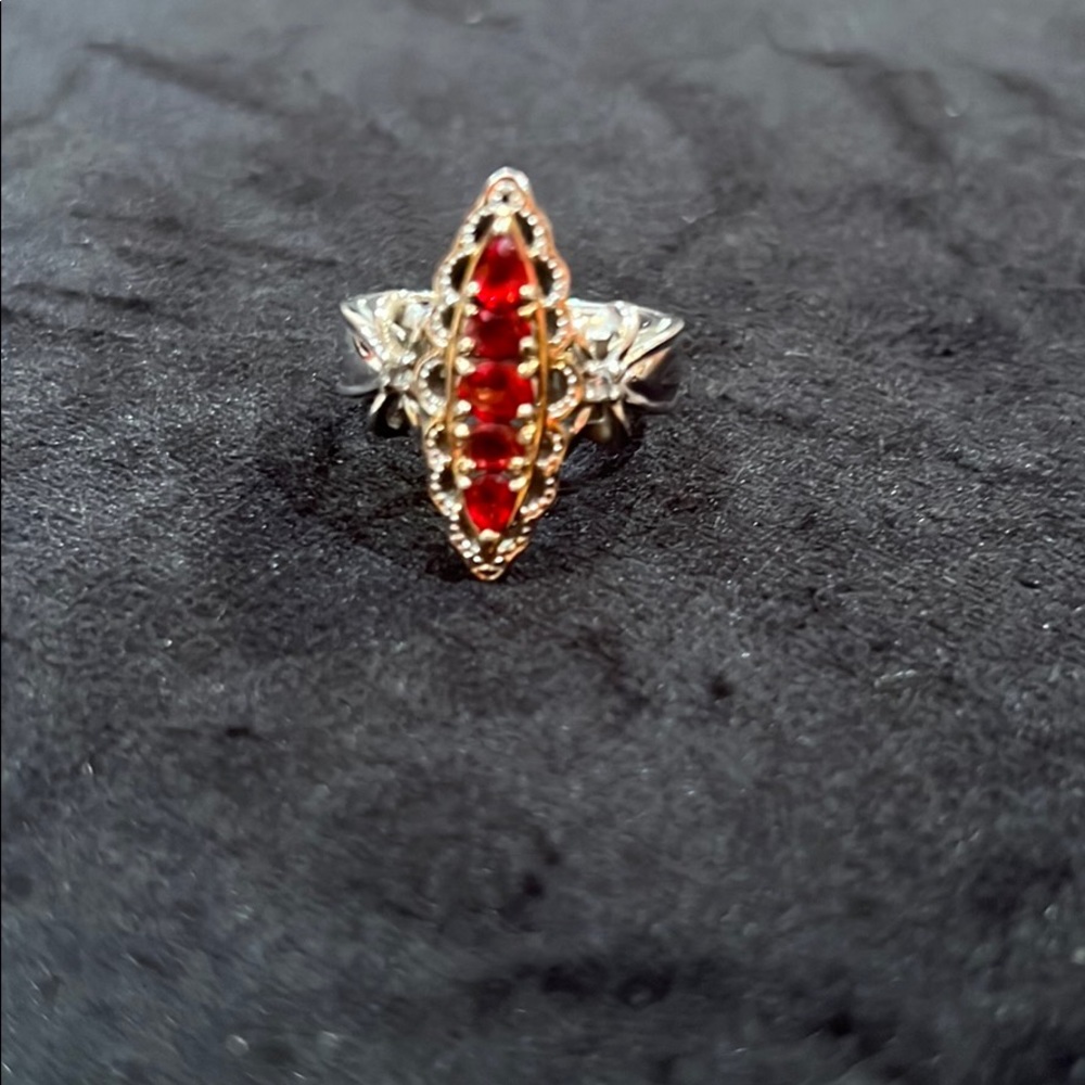 Beautiful ring with burnt orange stones.